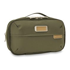 an olive green travel bag with gold accents