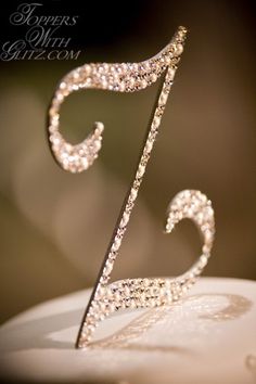 a close up of a white cake with a fancy design on it's top