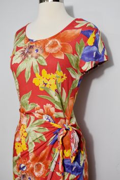 "If you love rayon and you love a sarong dress, this is the dress for you! The colorway makes me think of a summer evening, with its warmer palette. The rayon is soft and has a great drape, as usual. Lovely! 100% Rayon Marked size 3 No visible flaws! Bust 34\" Waist 28\" Hips 36\" Length 32\" ------------------------------------------------------------------------------------------------------- SEE MY SHOP at www.etsy.com/shop/MagicSummerVintage -------------------------------------------------- Red Ruched Midi Dress For Vacation, Red Fitted Tropical Dress, Red Ruched Maxi Dress For Beach, Red Ruched Maxi Dress For The Beach, Red Tropical Short Sleeve Dress, Red Tropical Summer Dress, Red Rayon Beach Dress, Red Rayon Summer Dress, Red Rayon Dress For Vacation