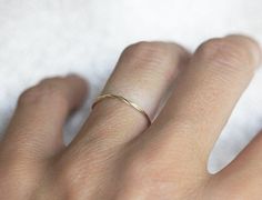 Best seller at Capucinne - Very delicate twisted solid gold ring. The twist is seen only at the front of the ring. This ring can be worn as a midi ring as well. If you would prefer a custom ring, please contact us before purchase. Details Thread Ring, Twist Wedding Band, Dainty Wedding Band, Delicate Gold Ring, Twisted Band Ring, Rope Ring, Twisted Ring, Wedding Bands For Her, Rope Rings