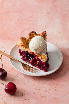 a slice of cherry pie with ice cream on top