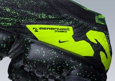 the inside of a soccer goalie's glove with green and black paint splattered on it