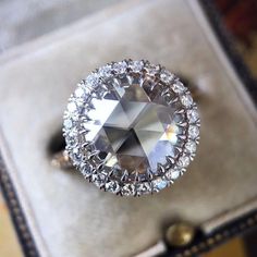 a diamond ring sitting on top of a box