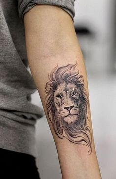 a lion tattoo on the arm