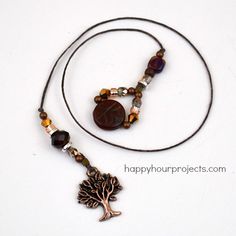 a necklace with a tree charm on it