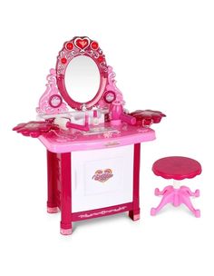 a pink toy vanity with mirror and stool