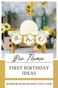 a baby's first birthday party with yellow and white decorations, balloons and flowers