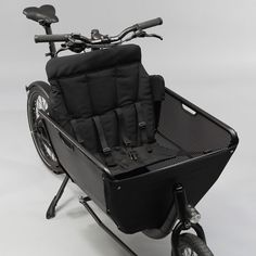 a bicycle with a side car attached to the front and rear wheels is shown in this image