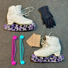 three pairs of shoes and gloves on the ground