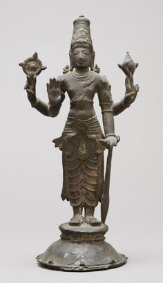 an old bronze statue holding two birds on it's arm, with one hand in the air