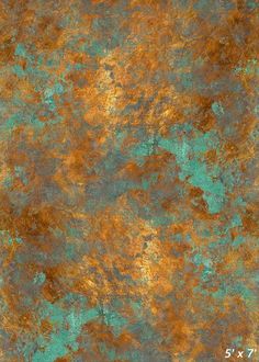 an old rusted metal surface with green and gold paint