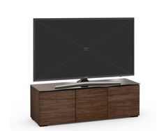 a flat screen tv sitting on top of a wooden cabinet