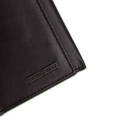 Tired of your old stretched out wallet? Using rubber bands to hold your cards and cash together? It’s time for a wallet that carries more in less space and looks great with everything. The Swissgear Trifold Wallet in black Napa leather gives you the convenience of a lightweight, compact size wallet when folded with plenty of capacity for everything you need. The inside of this small but mighty wallet is finished with four card slots, two slip pockets, one identification window and a large, lined Black Bifold Card Holder For Business, Black Trifold Wallet With Card Slots For Business, Black Trifold Wallet For Business With Card Slots, Black Trifold Wallet With Interior Card Slots For Business, Black Rfid Blocking Wallet For Business, Modern Black Leather Trifold Wallet, Black Rfid Blocking Wallets For Daily Use, Black Bifold Card Holder, Everyday Black Rfid Blocking Wallet