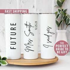 three white tumbles with the words future bride to be printed on them, sitting on a wooden tray