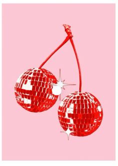 two shiny red disco balls hanging from a hook on a pink background with white stars