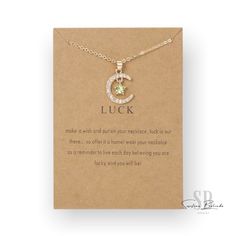 LUCKY CHARM BIRTHSTONE NECKLACE Gold tone metal alloy features a birthstone star and diamond moon Genuine cubic zircona Chain measures approximately 18.5" Cubic Zirconia Jewelry With Moon Charm For Gift, Gift Star Charm Cubic Zirconia Necklace, Gift Cubic Zirconia Necklace With Star Charm, Cubic Zirconia Star Charm Necklace Gift, Birthstone Necklace, Lucky Charm, Make A Wish, Gold Tone Metal, Necklace Gold