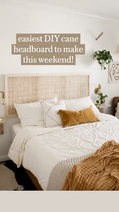 a bed with white sheets and brown pillows