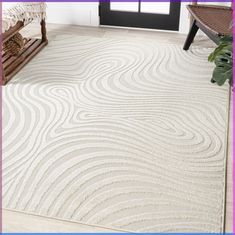 a large white rug with wavy lines on the floor in front of a door and bench