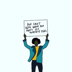 a person holding up a sign that says you can't heal what you don't let yourself feel