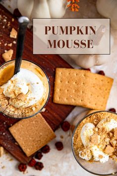 pumpkin mousse with graham crackers and whipped cream in glasses on a cutting board