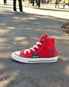 Introducing the I Like My Red Shoes | Pete the Cat Chucks by Androo's Art. These stylish and unique shoes are inspired by the beloved Pete the Cat character. These authentic Converse All-Stars have been given a one-of-a-kind makeover, making each pair unique and stylish. The bright red color is sure to make a statement and the classic Chuck Taylor design ensures comfort and durability. These shoes are perfect for any Pete the Cat fan and are sure to be a hit with kids and adults alike. Get your Red Chucks, Pete The Cat, Cat Character, Unique Shoes, Converse All Star, Red Shoes, Chuck Taylor, Bright Red