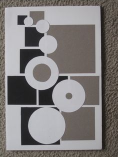 a piece of paper with circles and squares in it on the floor next to a carpet