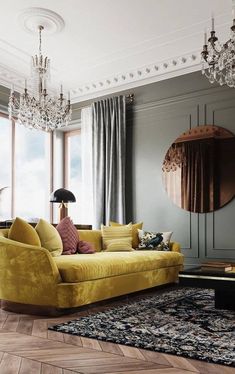 a living room filled with furniture and a chandelier