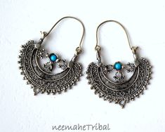 Silvertone crescent tribal earrings with turquoise jewels to ward off the evil eye. The crescent moon is a popular feature amongst old tribal cultures.  Length 5,5 cm / 2.16 " Width 4 cm / 1.57 " Weight of both earrings together 11 g Nickel-free Half Moon Bohemian Jewelry, Bohemian Half Moon Nickel-free Jewelry, Bohemian Crescent Jewelry Oxidized Finish, Bohemian Crescent Jewelry With Oxidized Finish, Bohemian Half Moon Metal Earrings, Bohemian Crescent Pierced Earrings, Bohemian Crescent Earrings, Crescent Shaped Festival Earrings, Bohemian Crescent Metal Earrings