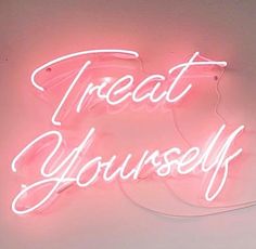 a neon sign that says treat yourself on the side of a white wall with pink lighting