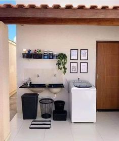 a bathroom with a washer and dryer sitting on the floor next to each other