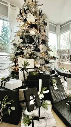 a decorated christmas tree with presents under it