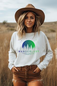 Indulge your wanderlust spirit with our vibrant camping sweatshirt adorned with a stunning nature graphic. Whether you're cozying up by the campfire or exploring the great outdoors, this sweatshirt is the perfect companion for any adventure. Embrace the beauty of nature while staying warm and stylish in this must-have piece for all nature enthusiasts. Let your wanderlust guide you to new horizons with this unique and eye-catching sweatshirt. Camping Sweatshirt, The Call Of The Wild, Stunning Nature, Call Of The Wild