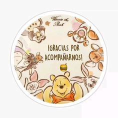 a white plate with winnie the pooh and other cartoon characters on it that says igracias por accompananarnos