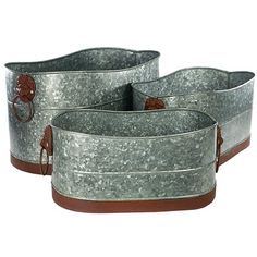 three metal buckets with leather handles on white background