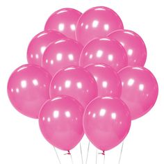 a bunch of pink balloons floating in the air