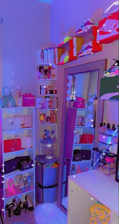 an image of a room that is lit up with neon lights and bags on the shelves