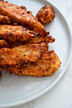 chicken wings on a white plate ready to be eaten