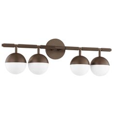 three lights on a wall mounted fixture with an adjustable arm and two white globes