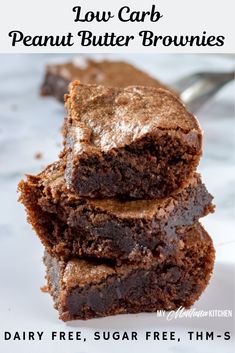 three brownies stacked on top of each other with the words low carb peanut butter brownies