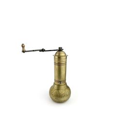 an old fashioned brass coffee grinder on a white background