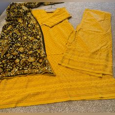 Brand New Chikankari Suit With Sequins And Phulkari Dupatta Length Of Shirt 49 Chest 39 Length Of Palazzo 37 Mustard Yellow Color Approx Measurements Traditional Yellow Georgette Palazzo Set, Designer Jamawar Yellow Kurta, Designer Yellow Jamawar Kurta, Yellow Jamawar Sets With Zari Work, Yellow Jamawar Designer Kurta, Traditional Drape Palazzo Set In Chinon With Self Design, Traditional Drape Palazzo Set With Self Design In Chinon, Yellow Salwar Kameez With Dupatta In Jamawar, Yellow Anarkali Jamawar Kurta