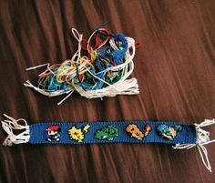 two bracelets that have been made to look like video games