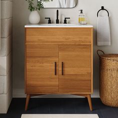 a bathroom with a sink, mirror and rug on the floor in front of it