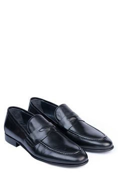 Handmade of smooth leather, this moc-toe dress shoe with a classic penny loafer silhouette offers a sophisticated, elegant look. Leather upper and lining/synthetic sole Made in Turkey Penny Loafers Men, Classic Slippers, Elegant Look, Flip Flop Slippers, Penny Loafer, Ugg Classic, Dress Shoe, Denim Branding, Sweaters And Leggings