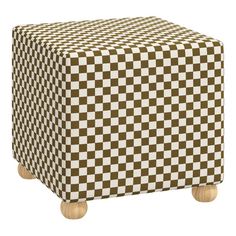 a brown and white checkered ottoman with wooden legs