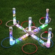 a group of lights that are in the grass with some wires attached to each other