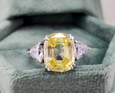 November Birthstone Ring, Citrine 3 Stone Engagement Ring, Canary Yellow Gemstone Ring, 925 Silver Cushion Cut CZ Ring Women, Size 6.50 US ➞ M E T A L - Solid 925 Sterling Silver - Rhodium Plated ➞ S T O N E - Stone Type : Cubic Zirconia - Stone Shape : Cushion Cut & Triangle Cut - Stone Clarity : Eye Clean & VVS1 - Stone Color : Yellow & D/White - Total Carat Weight : 4.50 Ct - Ring Size : 6.50 USA - Ready To Ship  - Your ring would come with a Luxury ring box that would make the gifting a beautiful experience. ➞ S H I P P I N G  - Free Standard Shipping To USA ➞ C O N T A C T U S  - Require any assistance with regards to jewellery, then please feel free to contact us. Thank you for Visiting Us! Yellow Three Stone Ring For Gift, Yellow Three Stone Rings As Gift, Yellow Three-stone Rings, Yellow Gemstone Ring, 3 Stone Engagement Ring, November Birthstone Ring, Silver Cushions, Luxury Ring, 3 Stone Engagement Rings