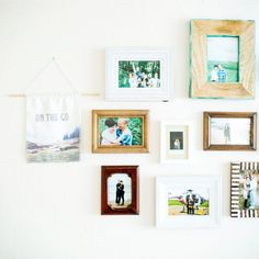 a wall with many different pictures hanging on it