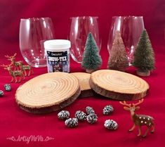 several wine glasses and some christmas decorations on a red background