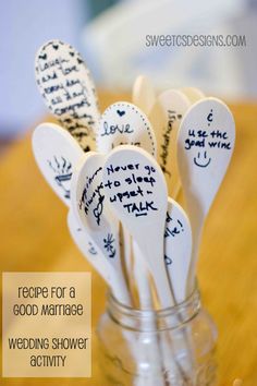 spoons with writing on them are in a glass jar that says recipe for a good marriage